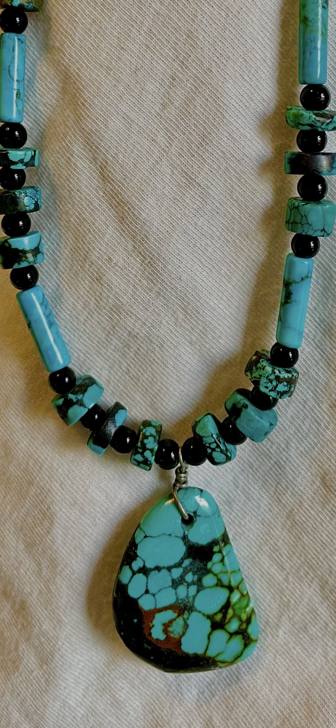 Turquoise pendant with rough cut turquoise accent beads and black Onyx spacers
