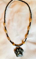 Golden obsidian paw print pendant necklace