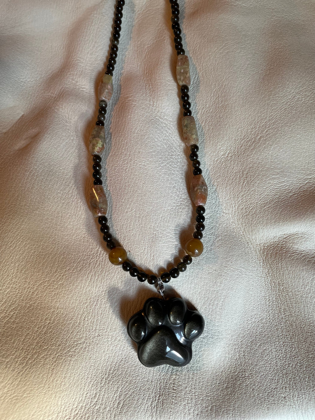 Golden obsidian paw print pendant necklace