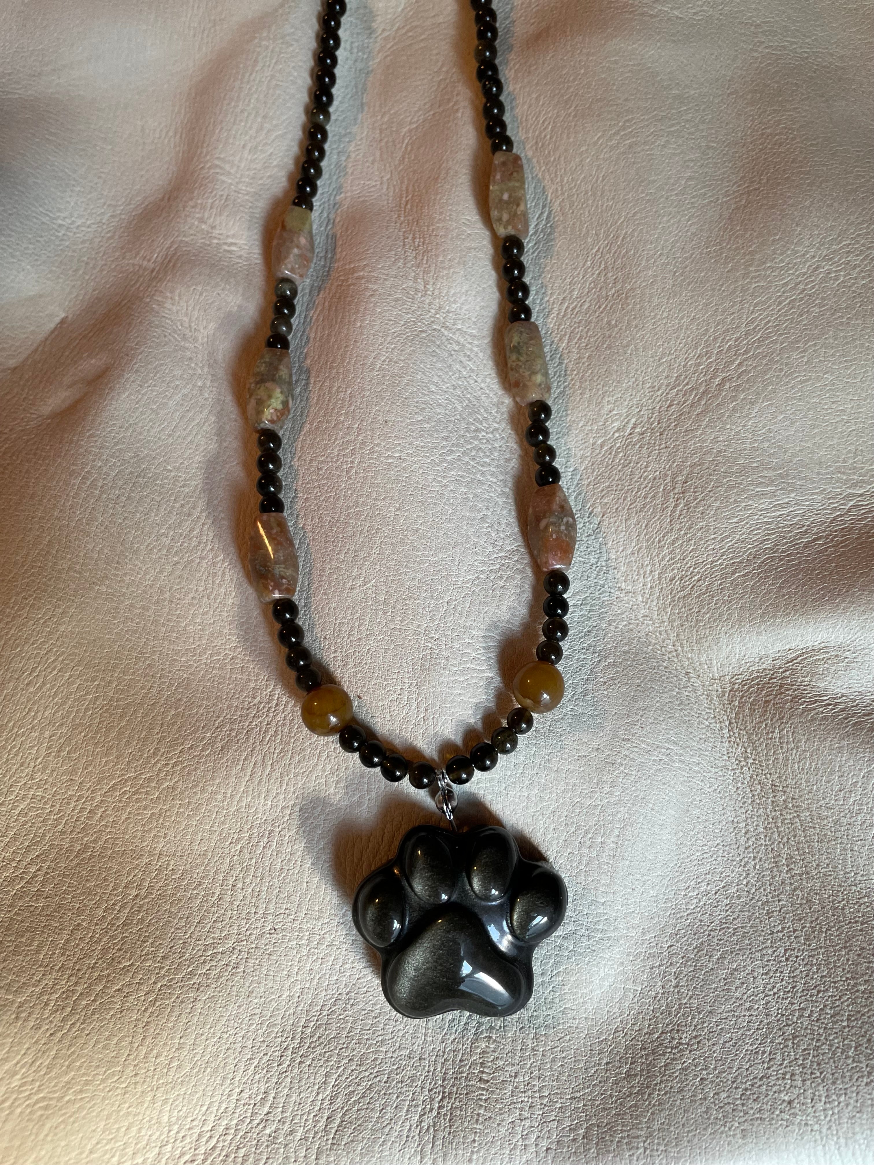 Golden obsidian paw print pendant necklace