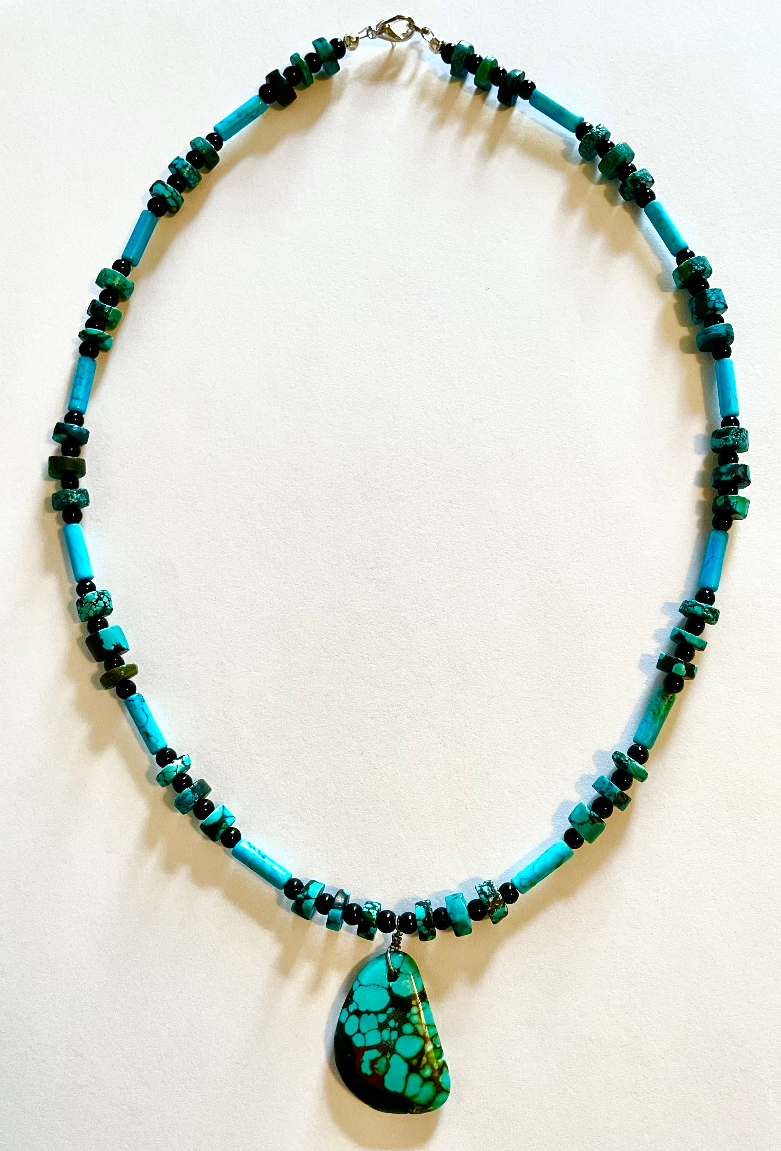 Turquoise pendant with rough cut turquoise accent beads and black Onyx spacers