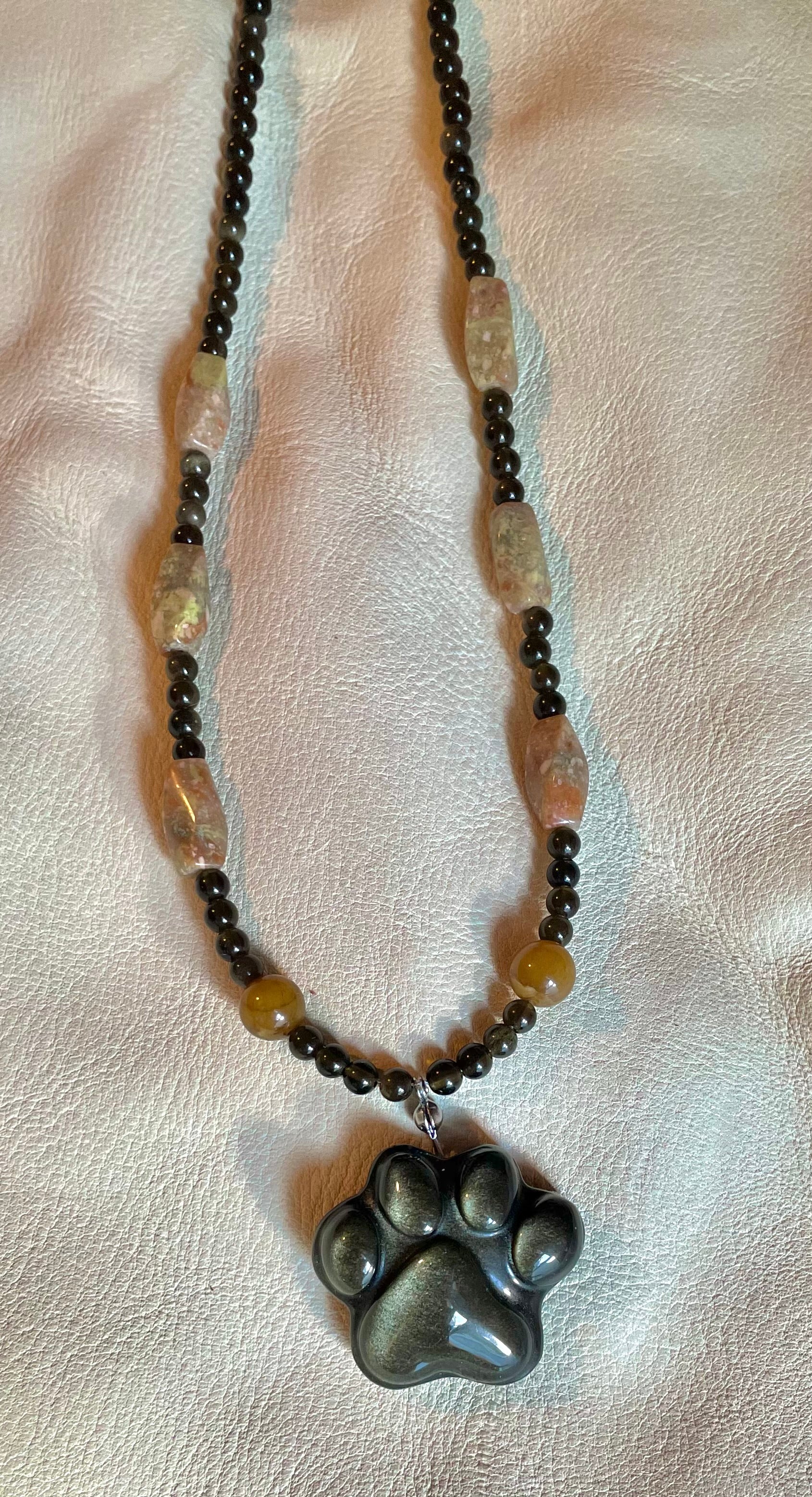 Golden obsidian paw print pendant necklace